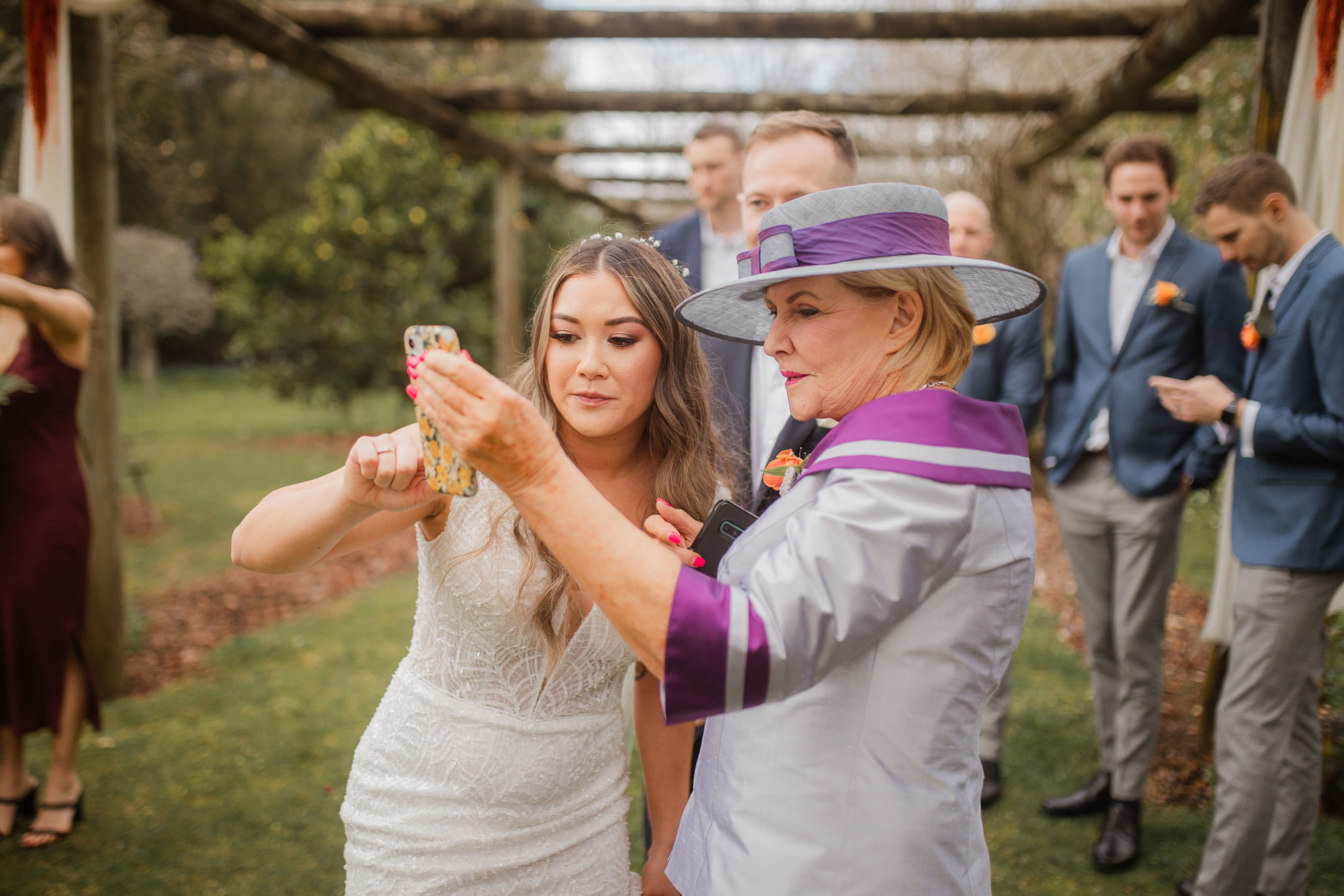 bride doing face time during wedding