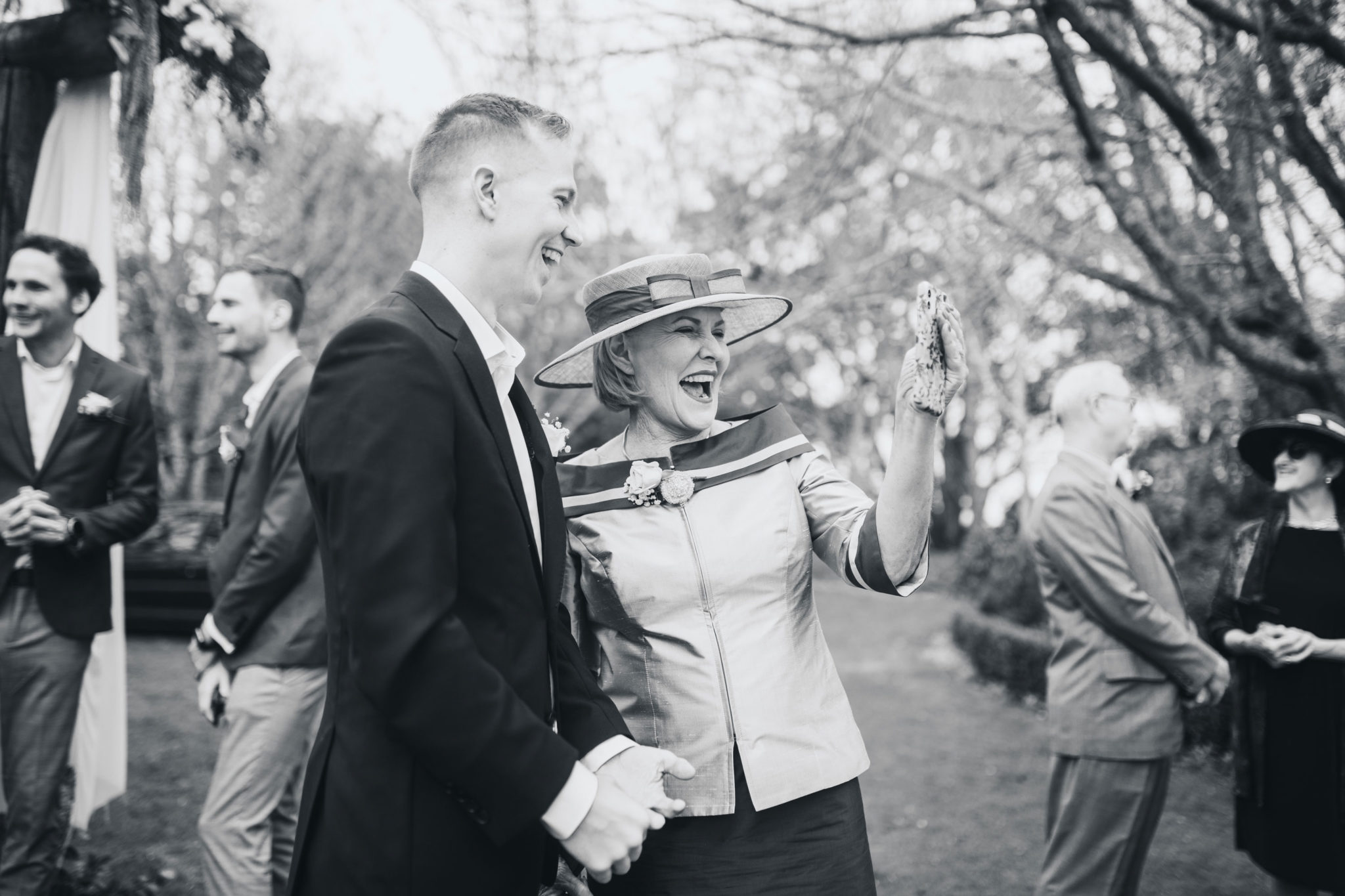 groom and mother laughing