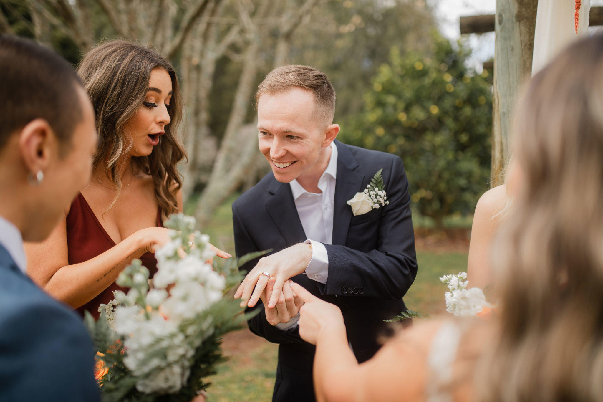 groom showing off ring