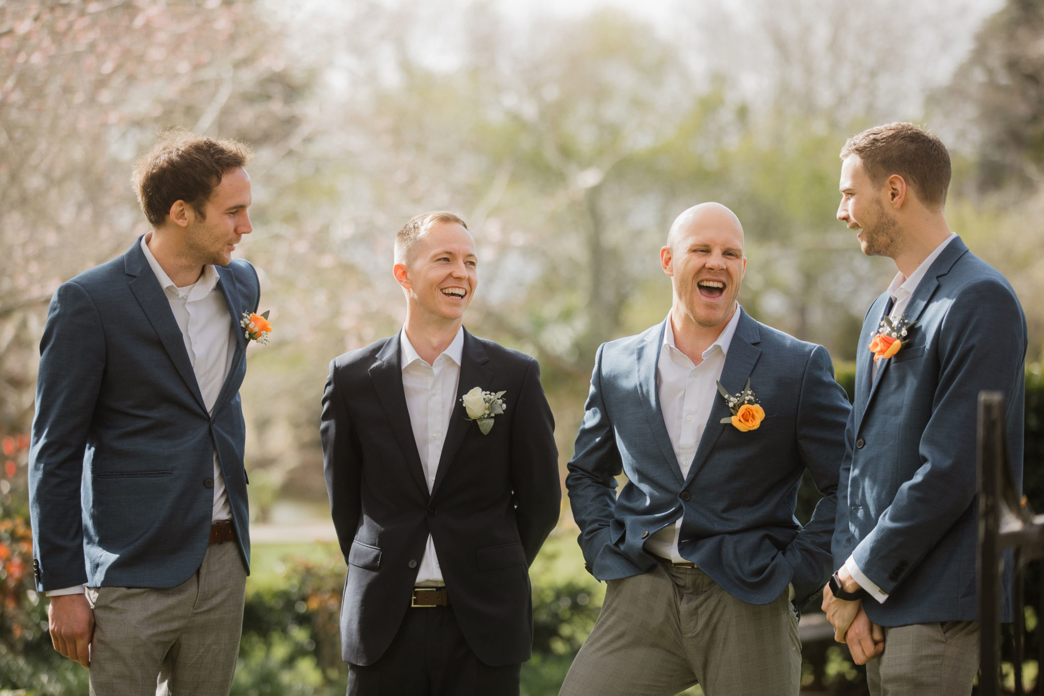 groom and groomsmen laughing