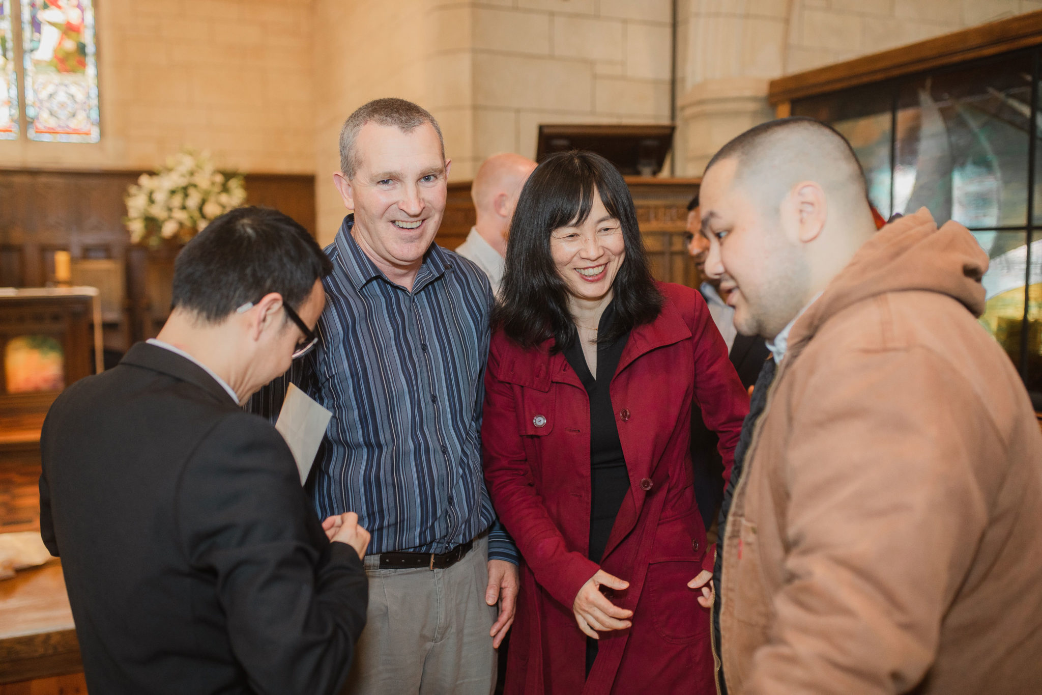 wedding guests congratulating the groom