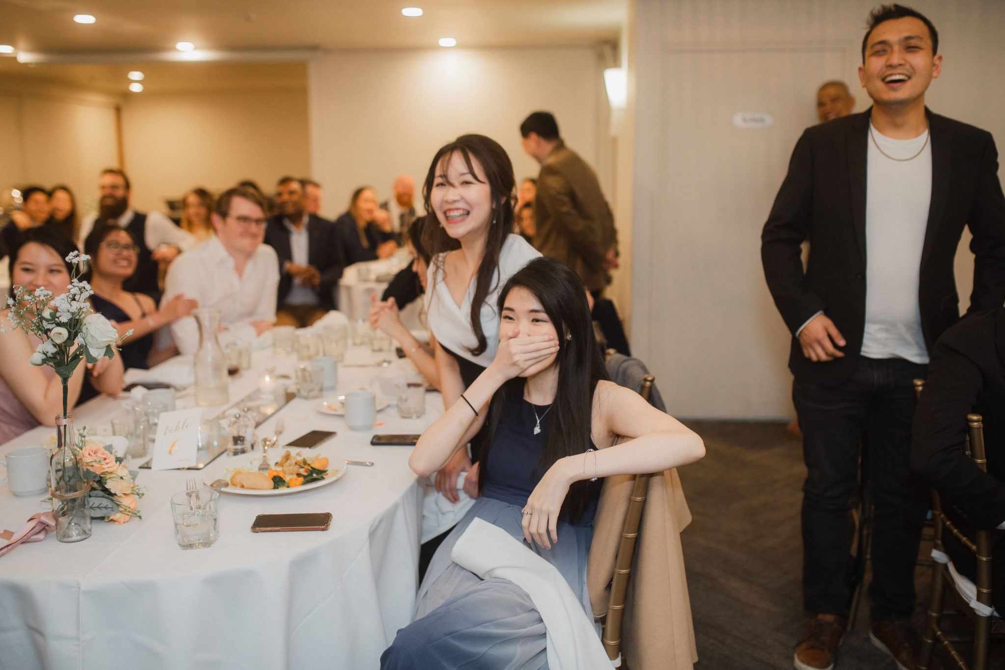 wedding guests laughing