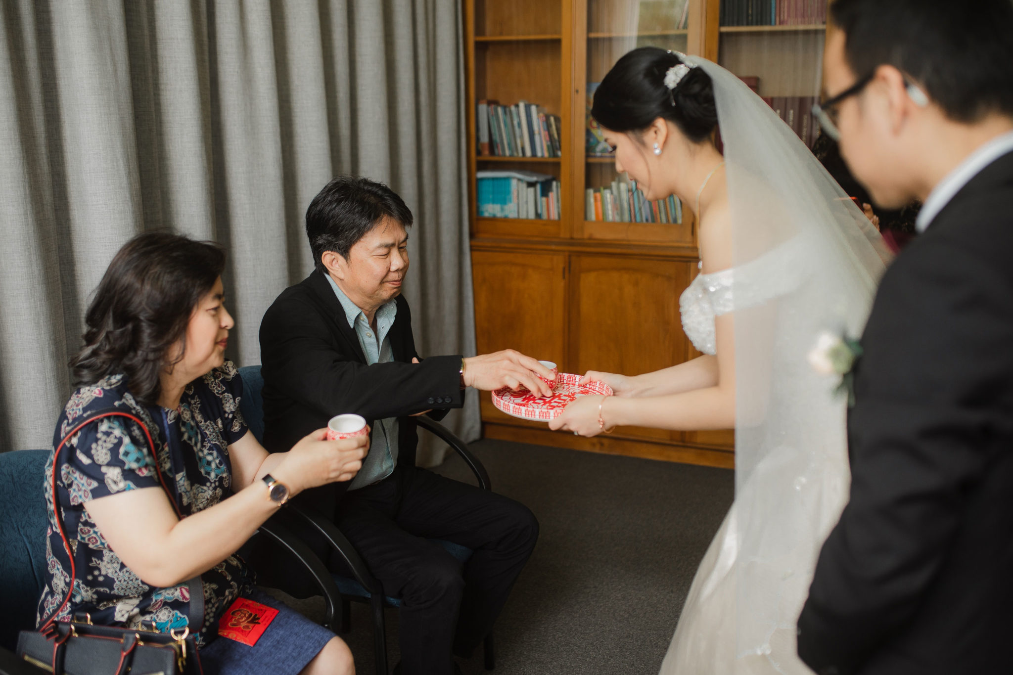 bride serving tea during ceremony