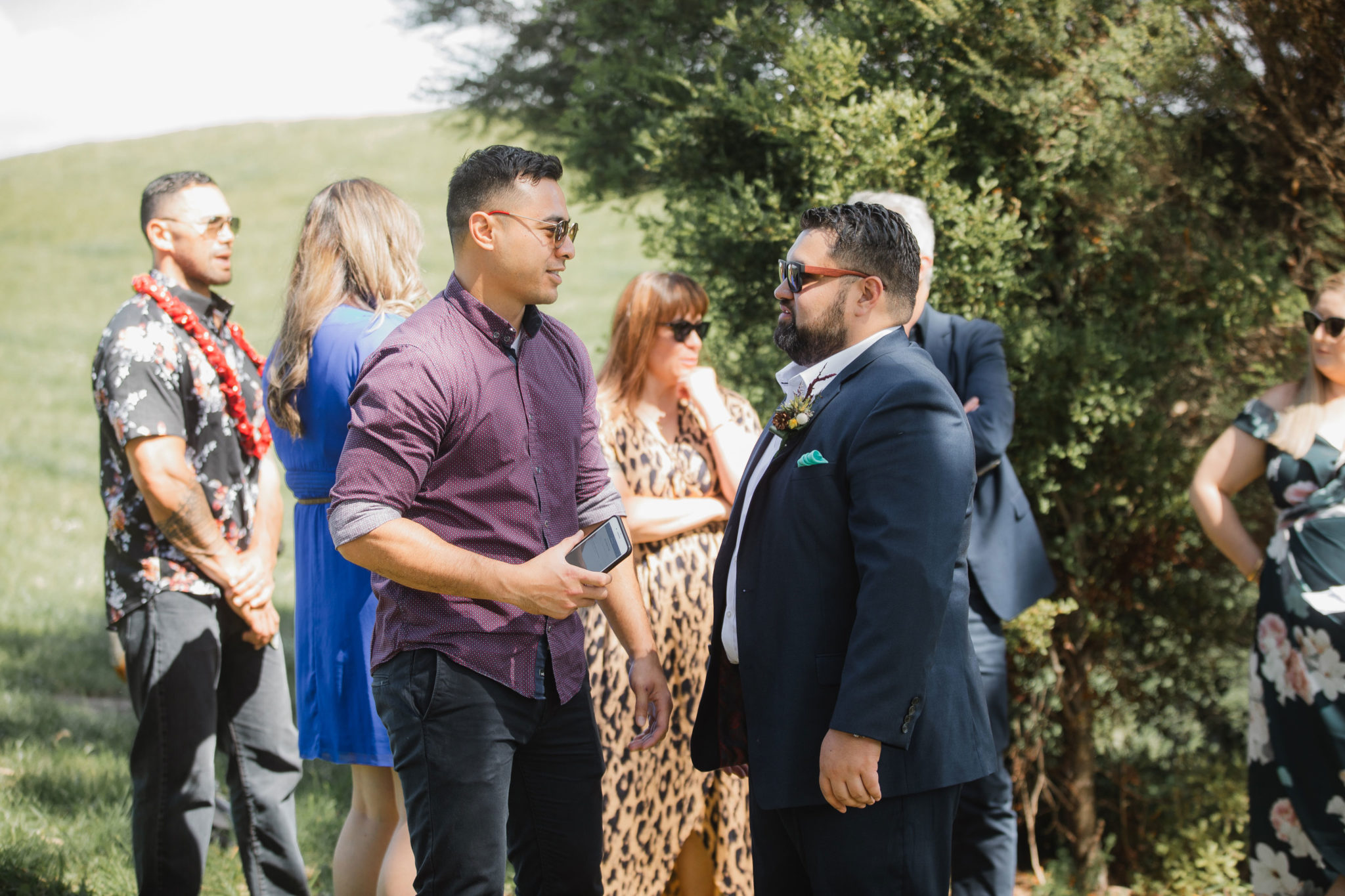 groom talking to wedding guest