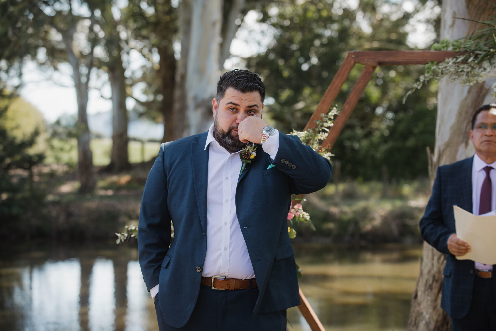 groom crying seeing the bride