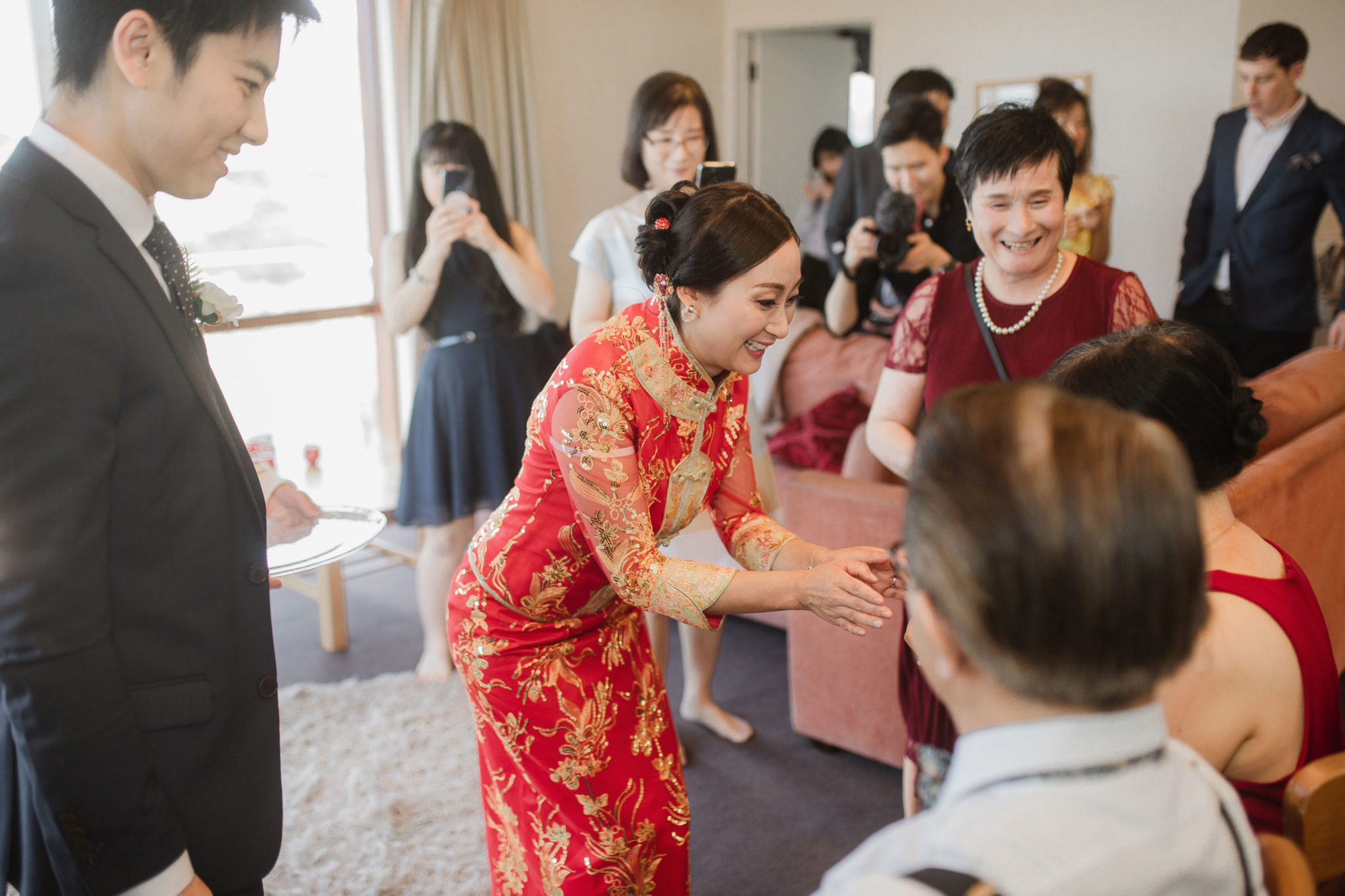 bride serving tea to elders