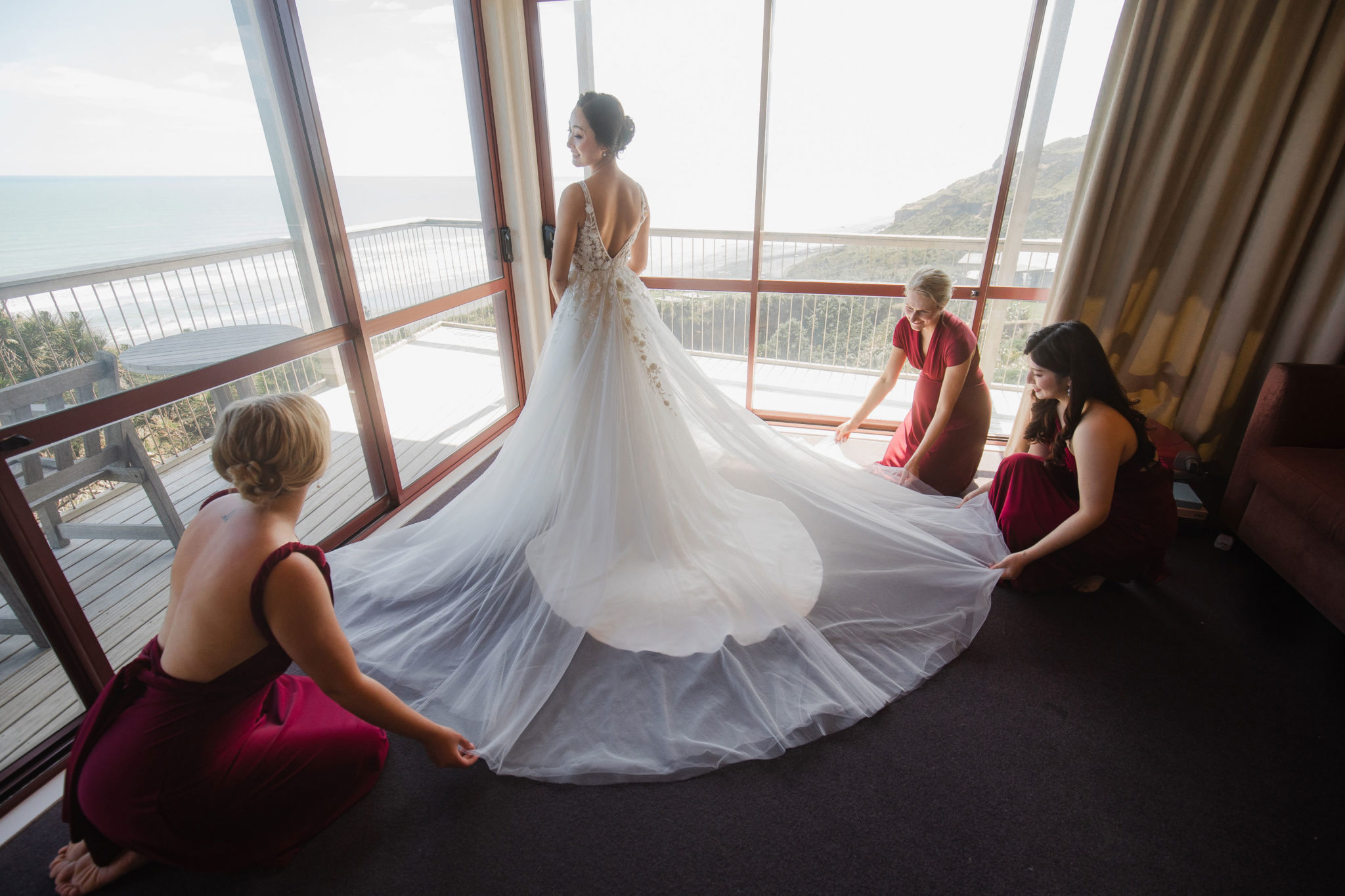 bride and bridesmaids with dress