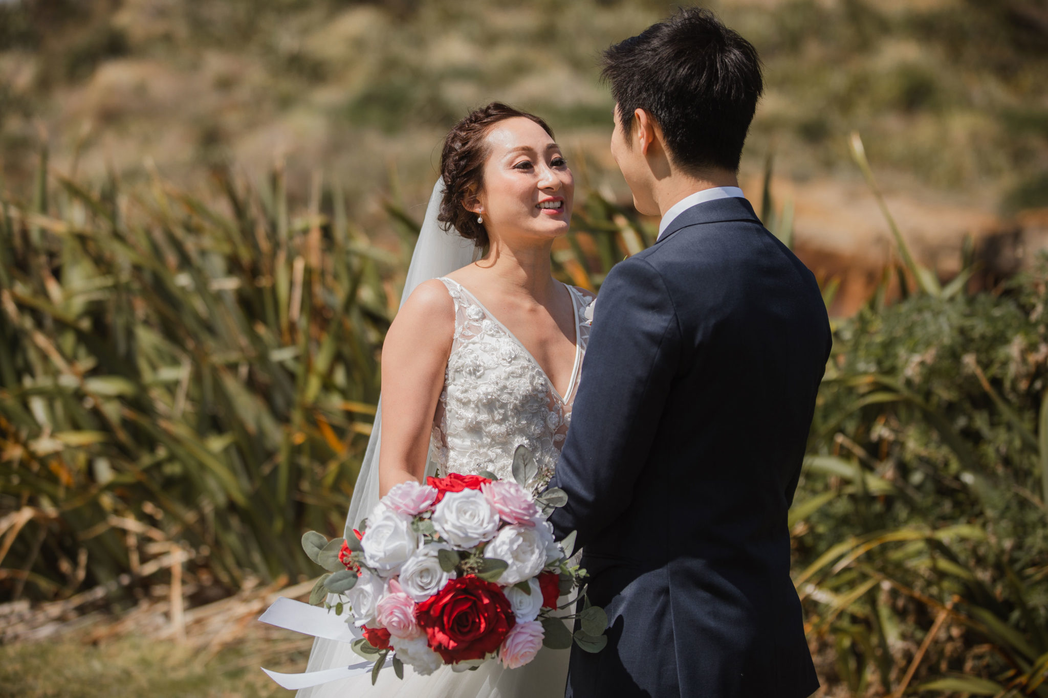 bride looking at the groom