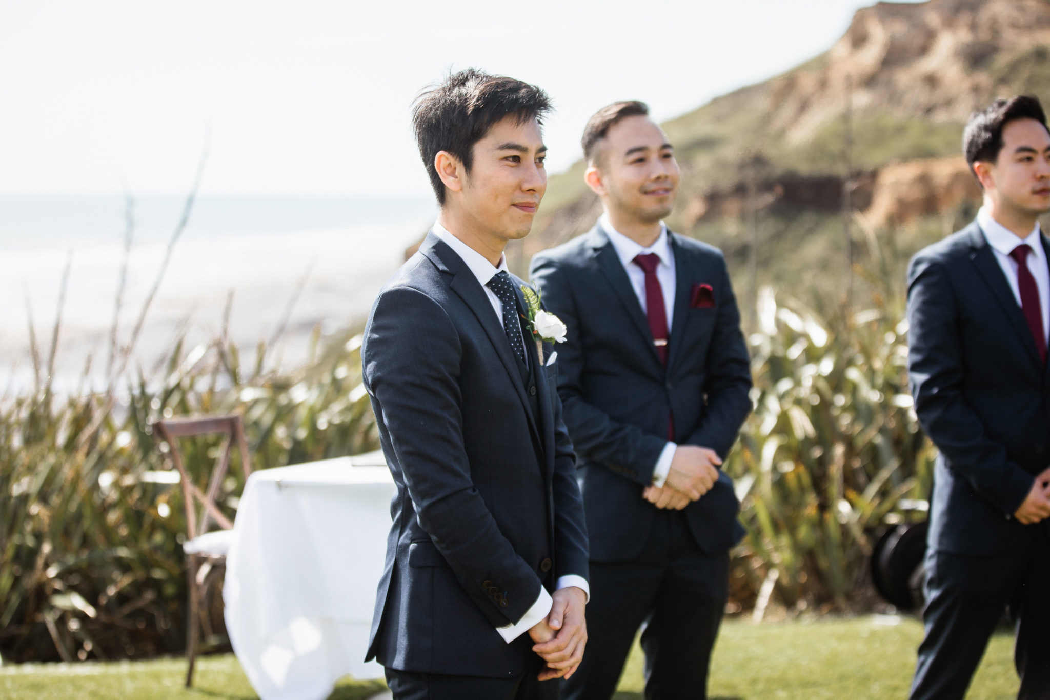 groom looking at the bride