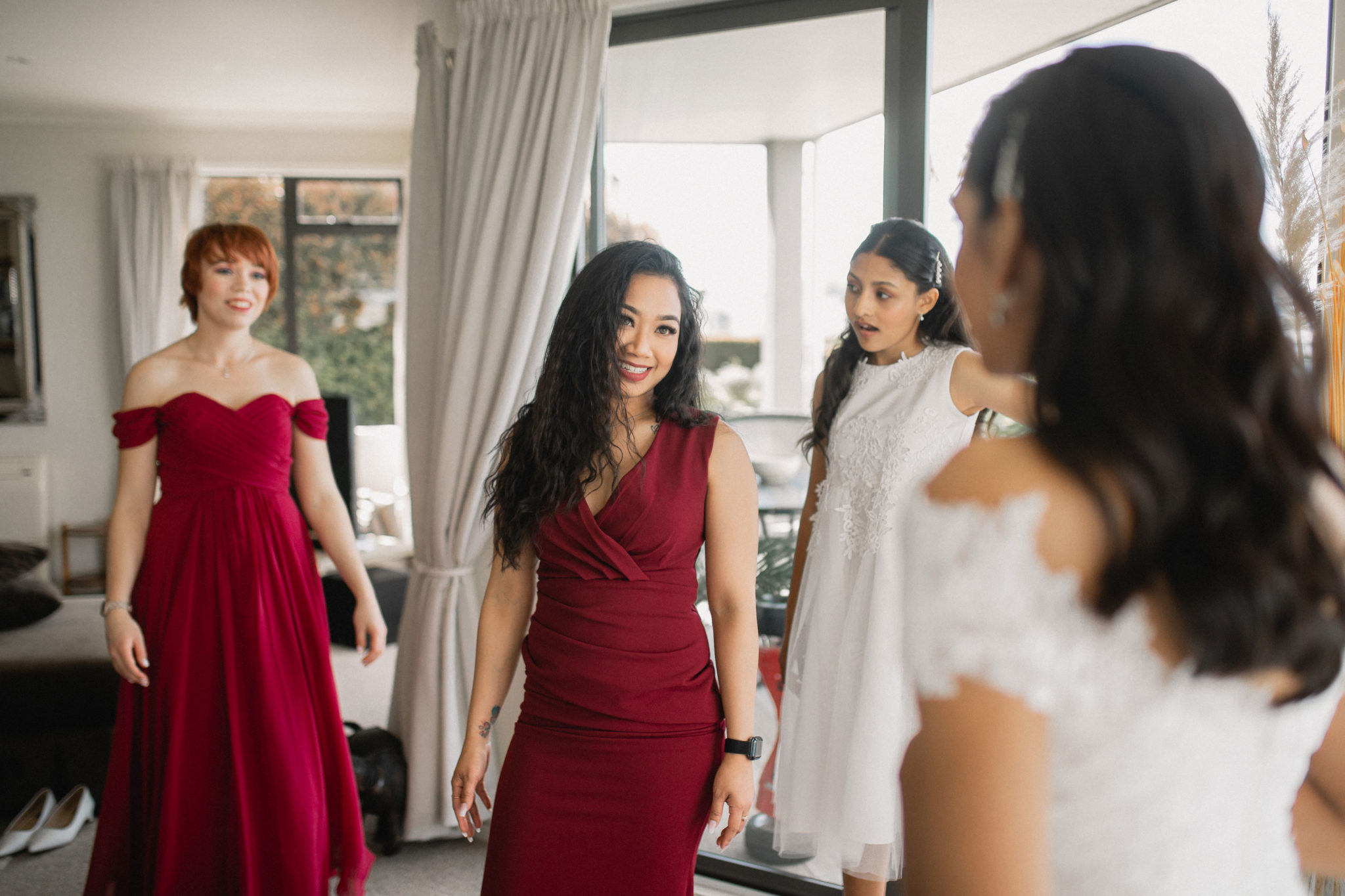 bridal party looking at bride