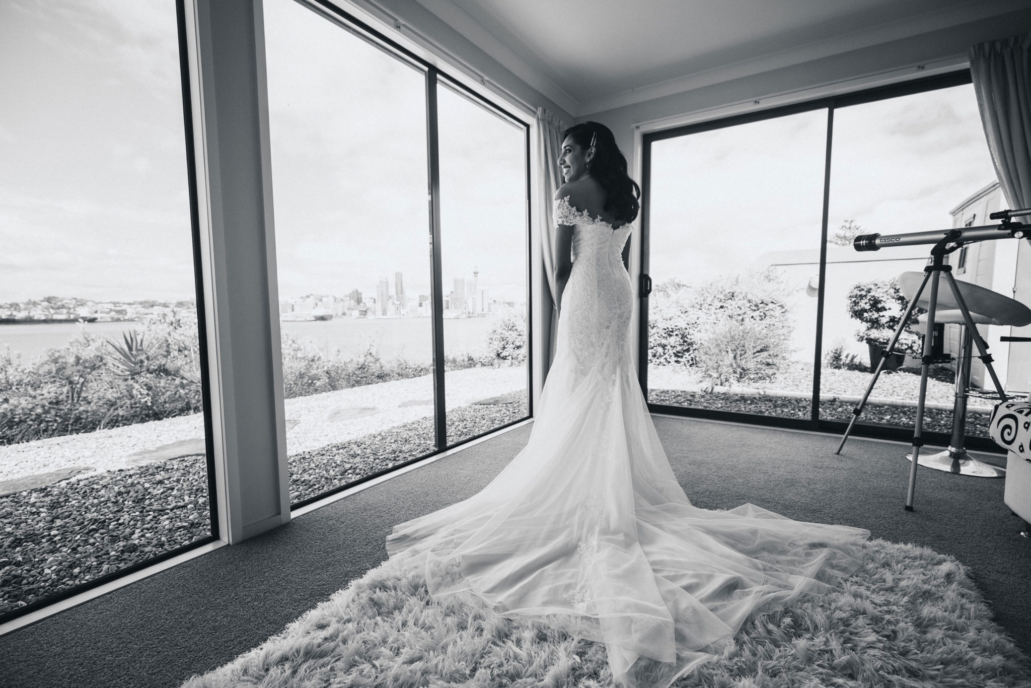 bride in her dress looking at auckland city