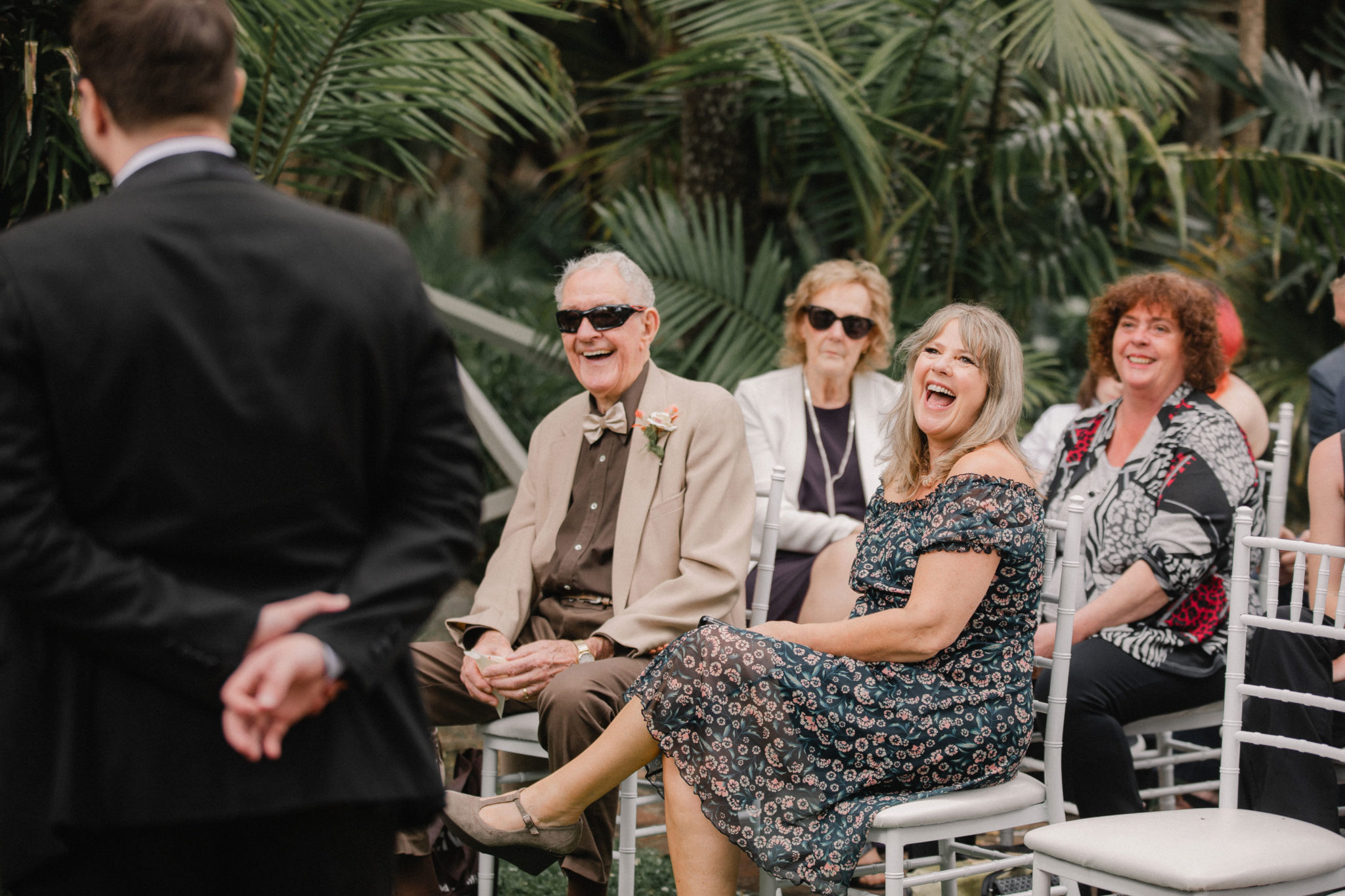 family of the groom laughing