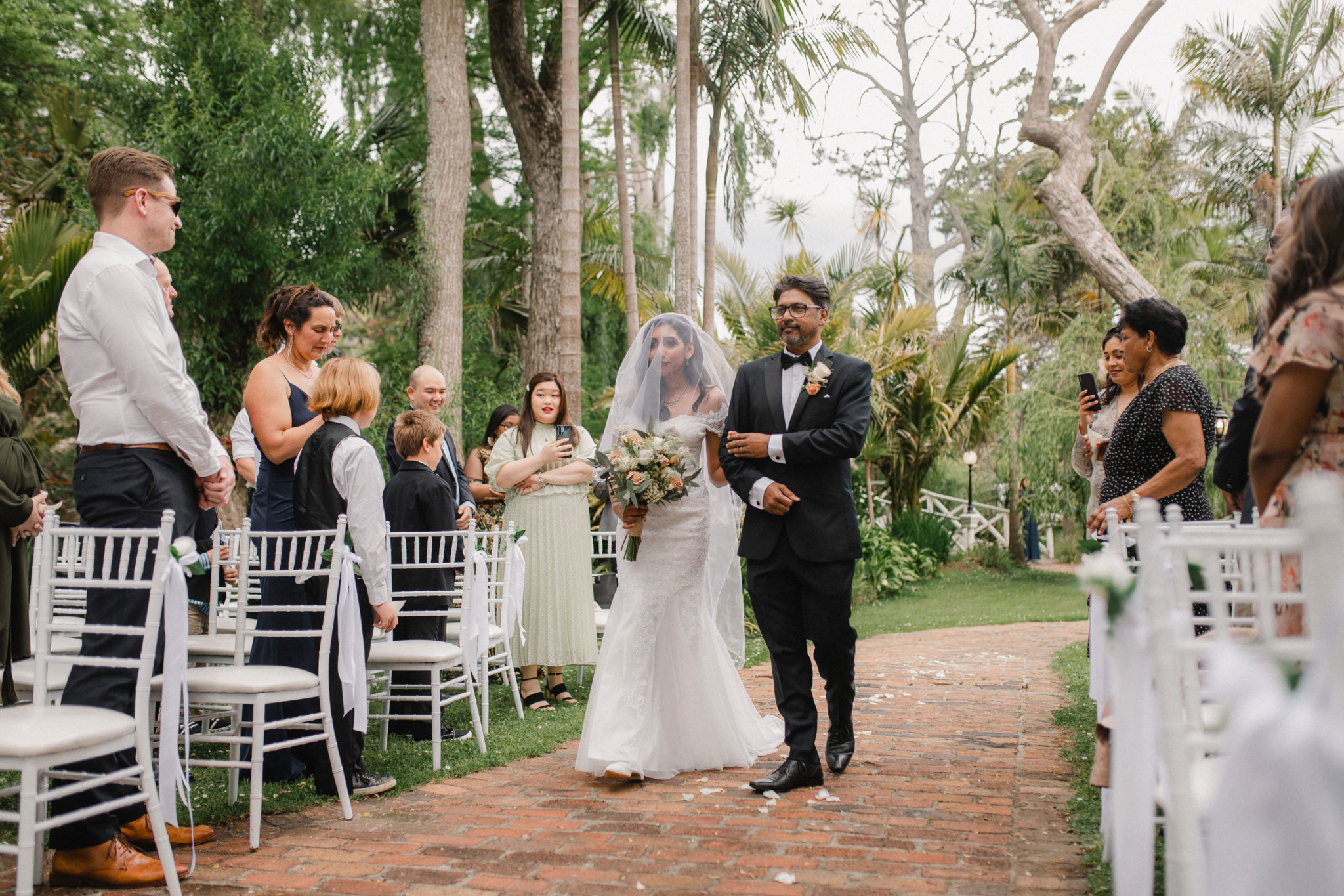 bride walking down the aisle with father