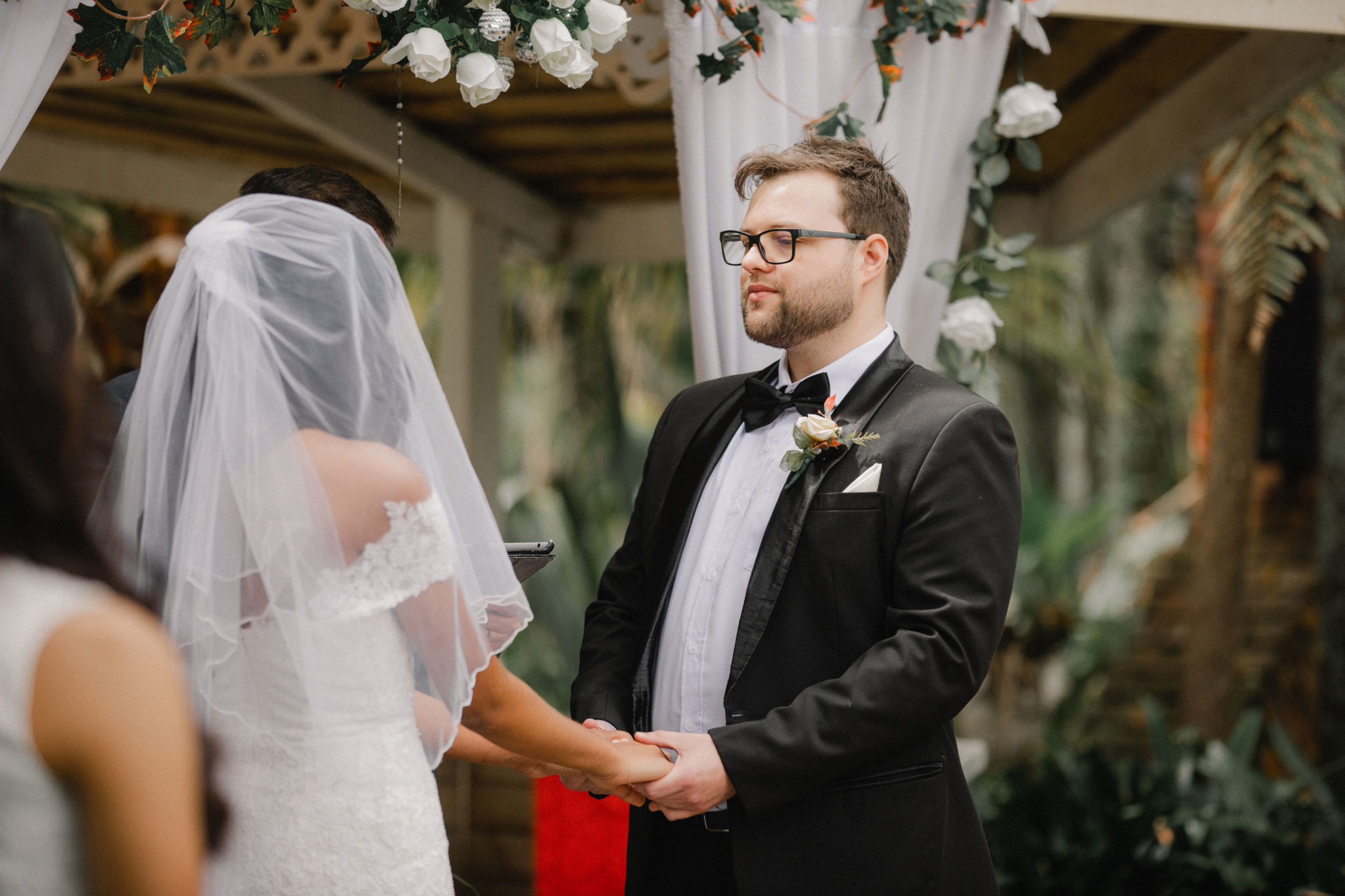 groom looking at the bride