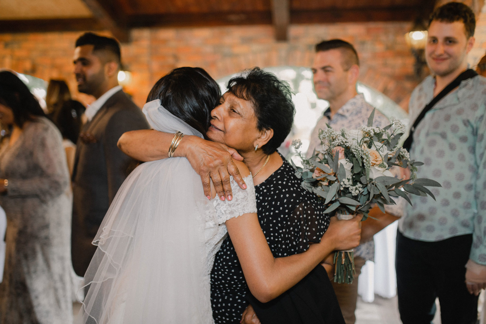 bride hugging guests