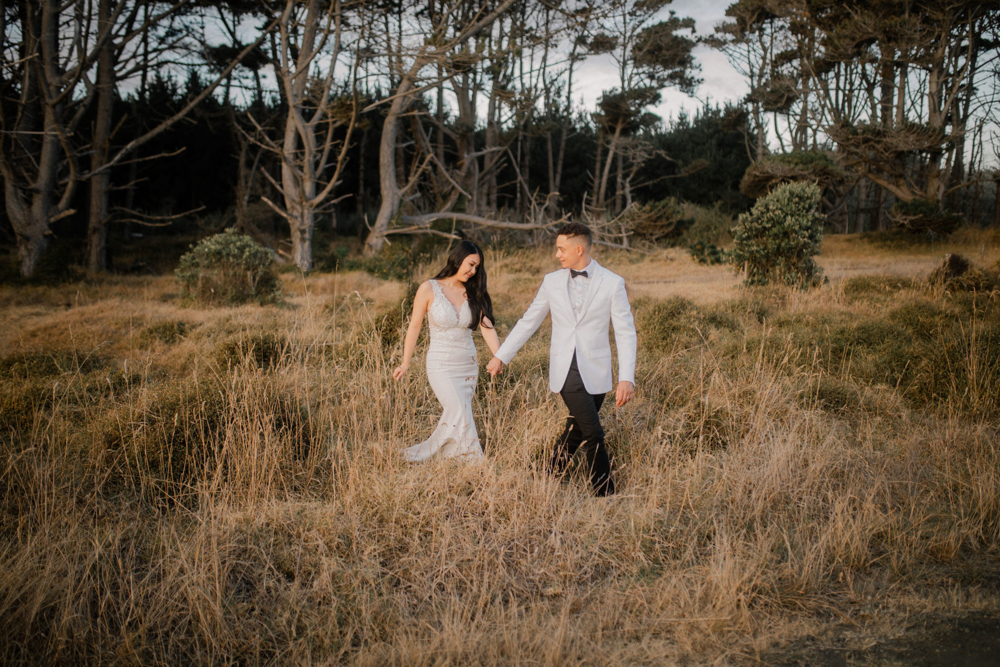 couple taking a stroll at muriwai