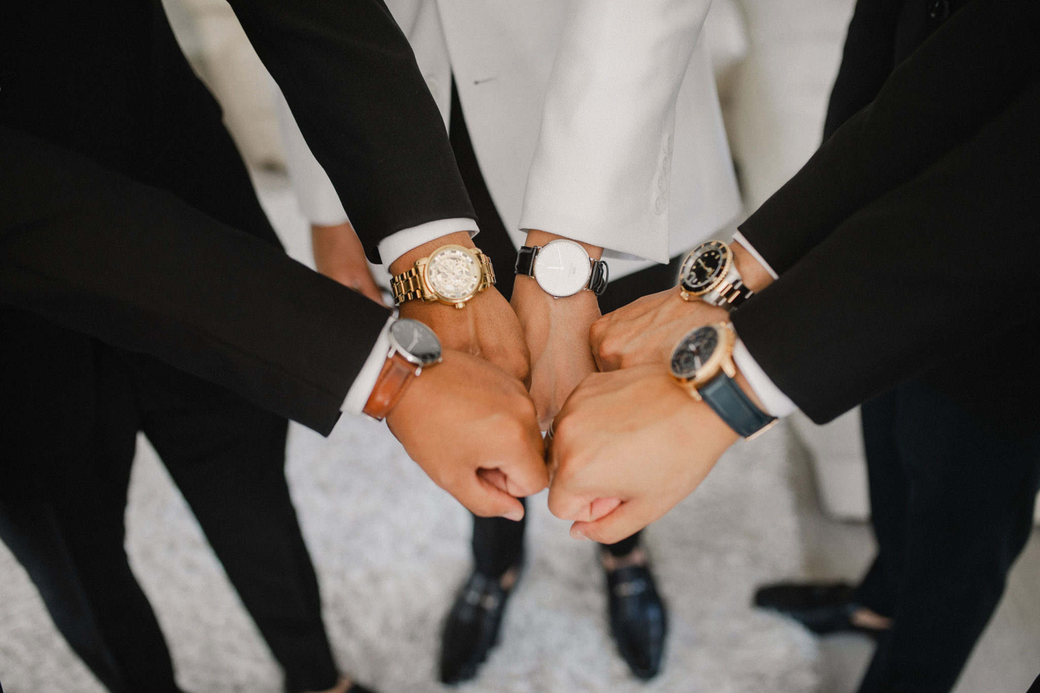groomsmen showing their watches