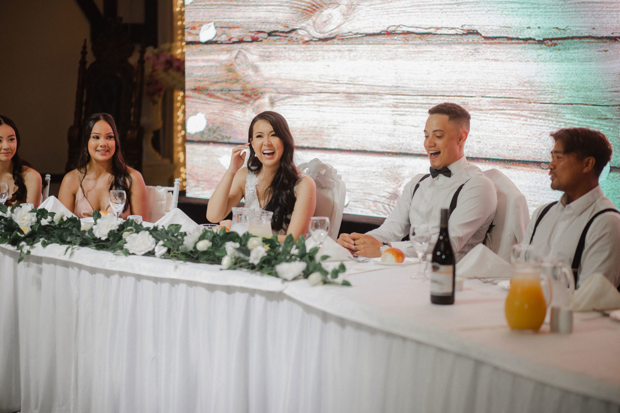 bride and groom laughing