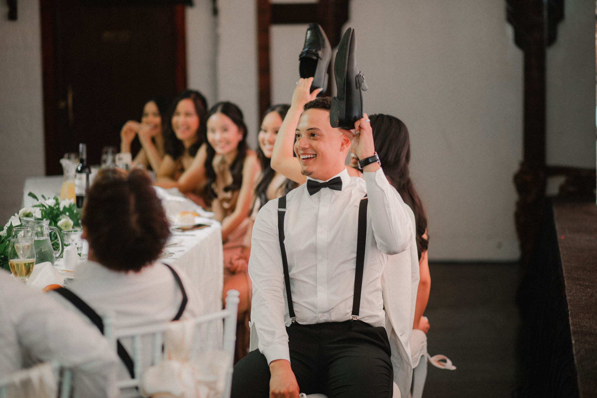 bride and groom playing the shoe game