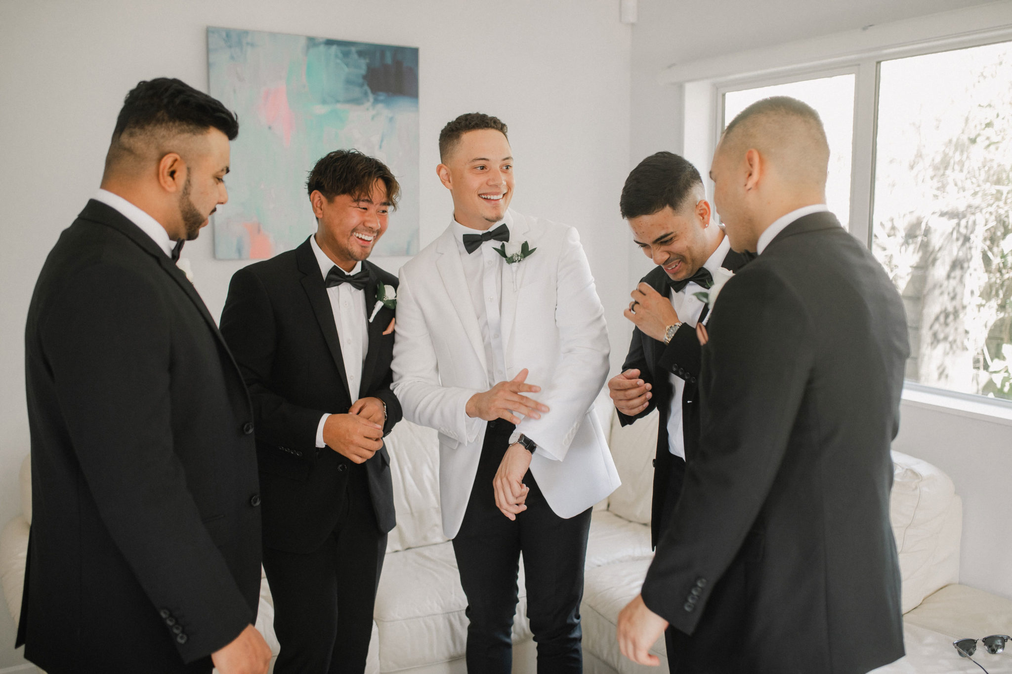 groom and groomsmen having a laugh