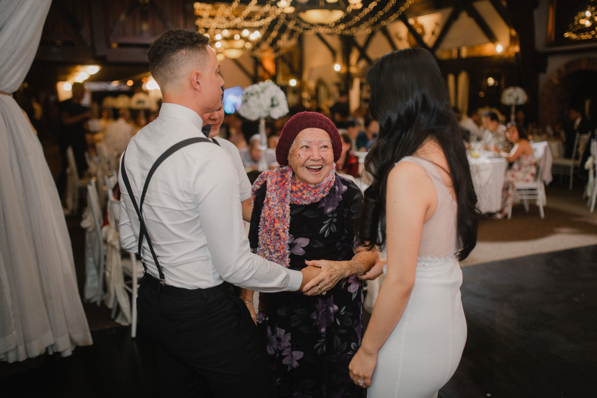 bride and groom talking to nana