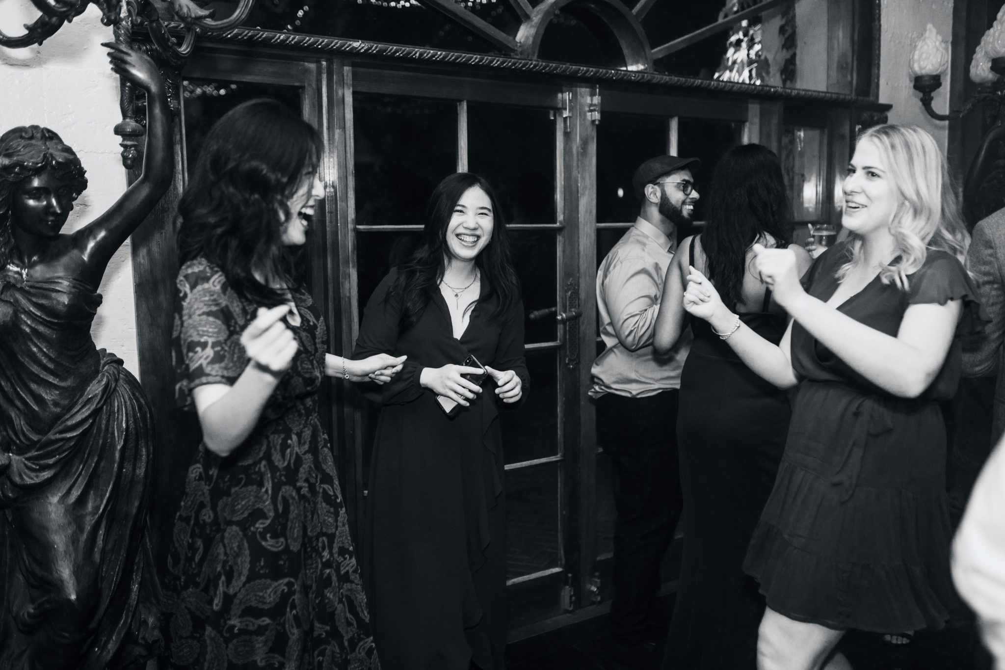 wedding guests enjoying themselves on the dance floor