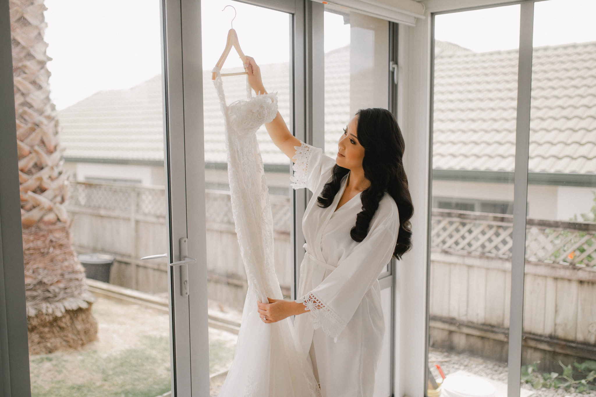 bride looking at her wedding dress