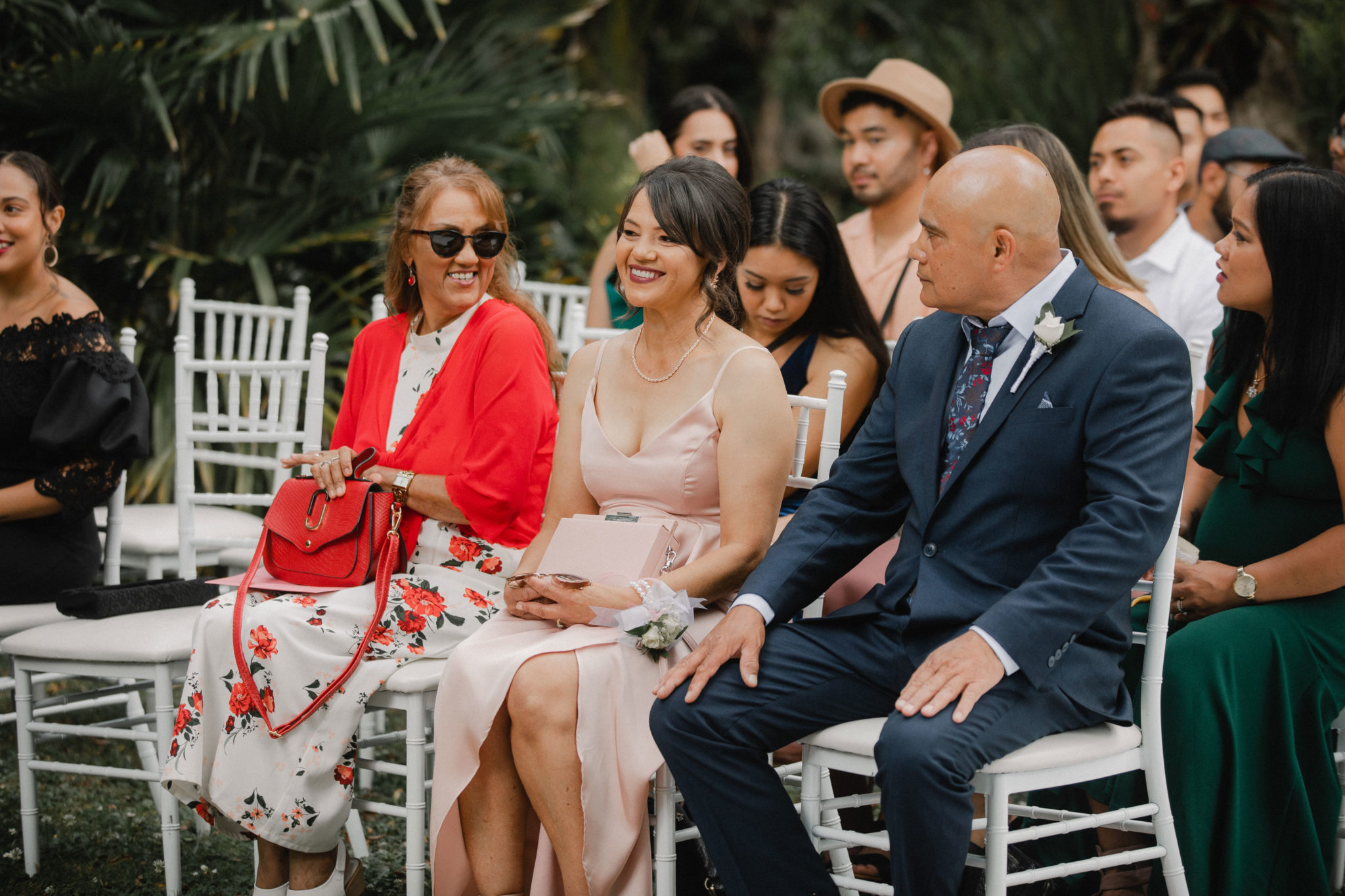 wedding guests talking at the ceremony