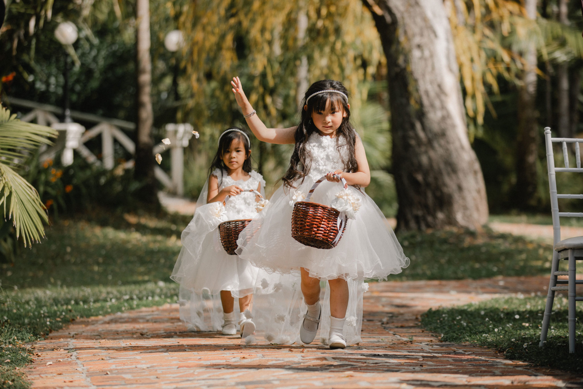 flower girls throwing flower petals