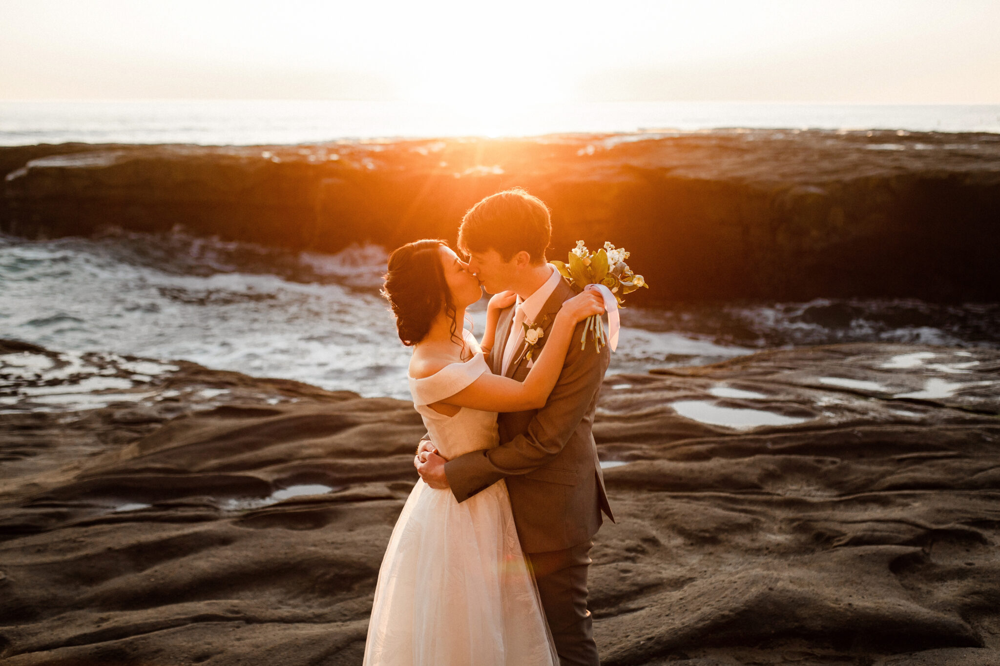 muriwai beach sunset couple