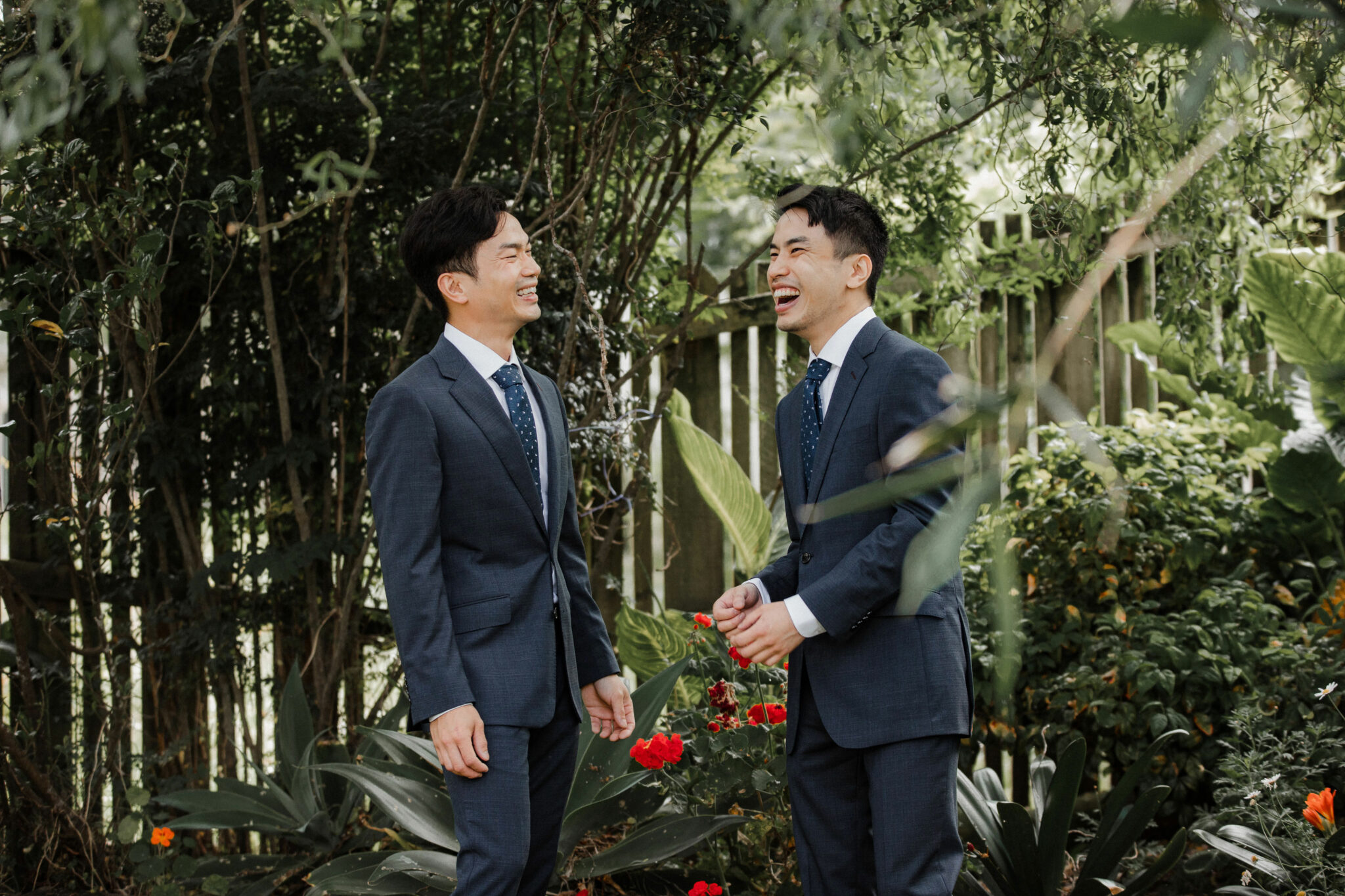 groom and groomsman having a laugh