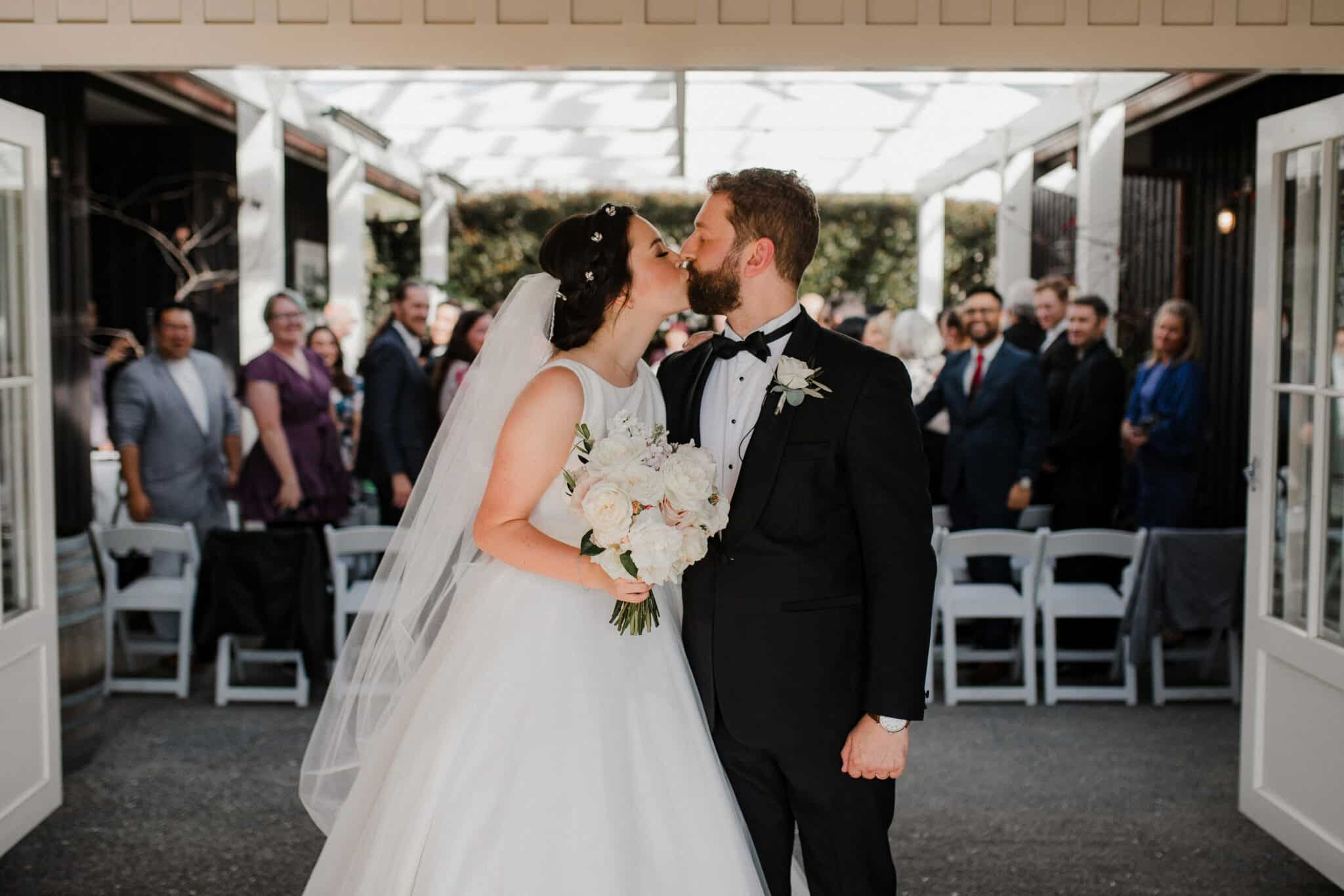 bride and groom kiss wedding