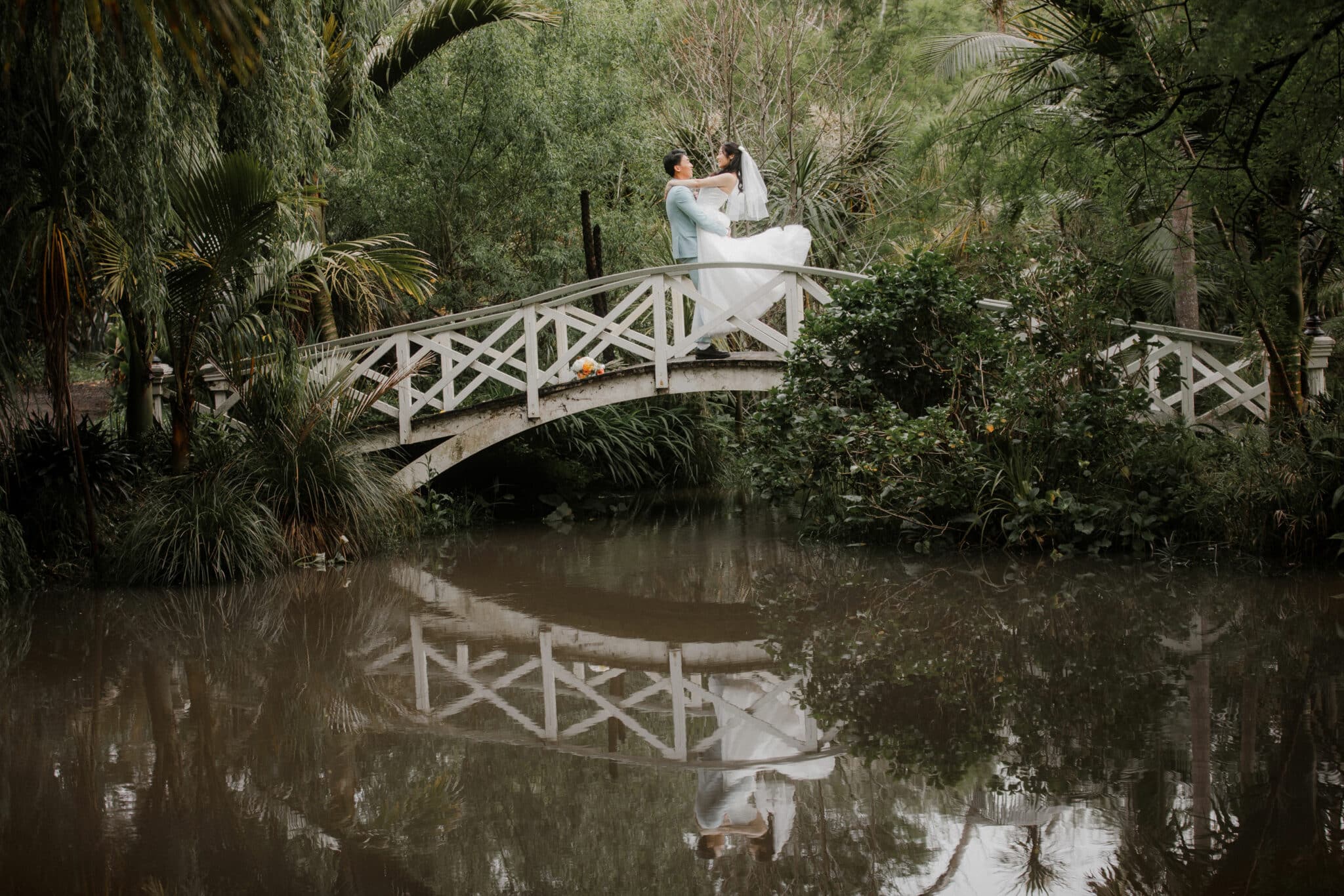 groom lifting bride