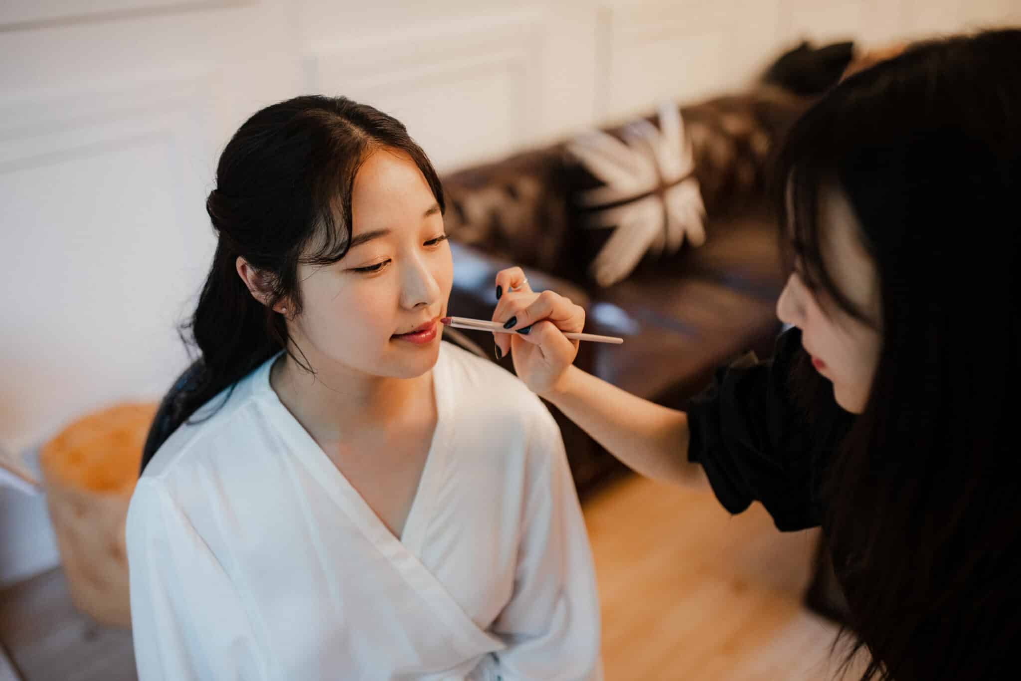 bride getting makeup done