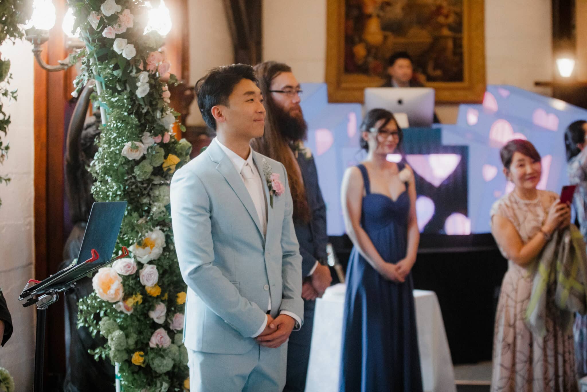 groom waiting for the bride at the altar