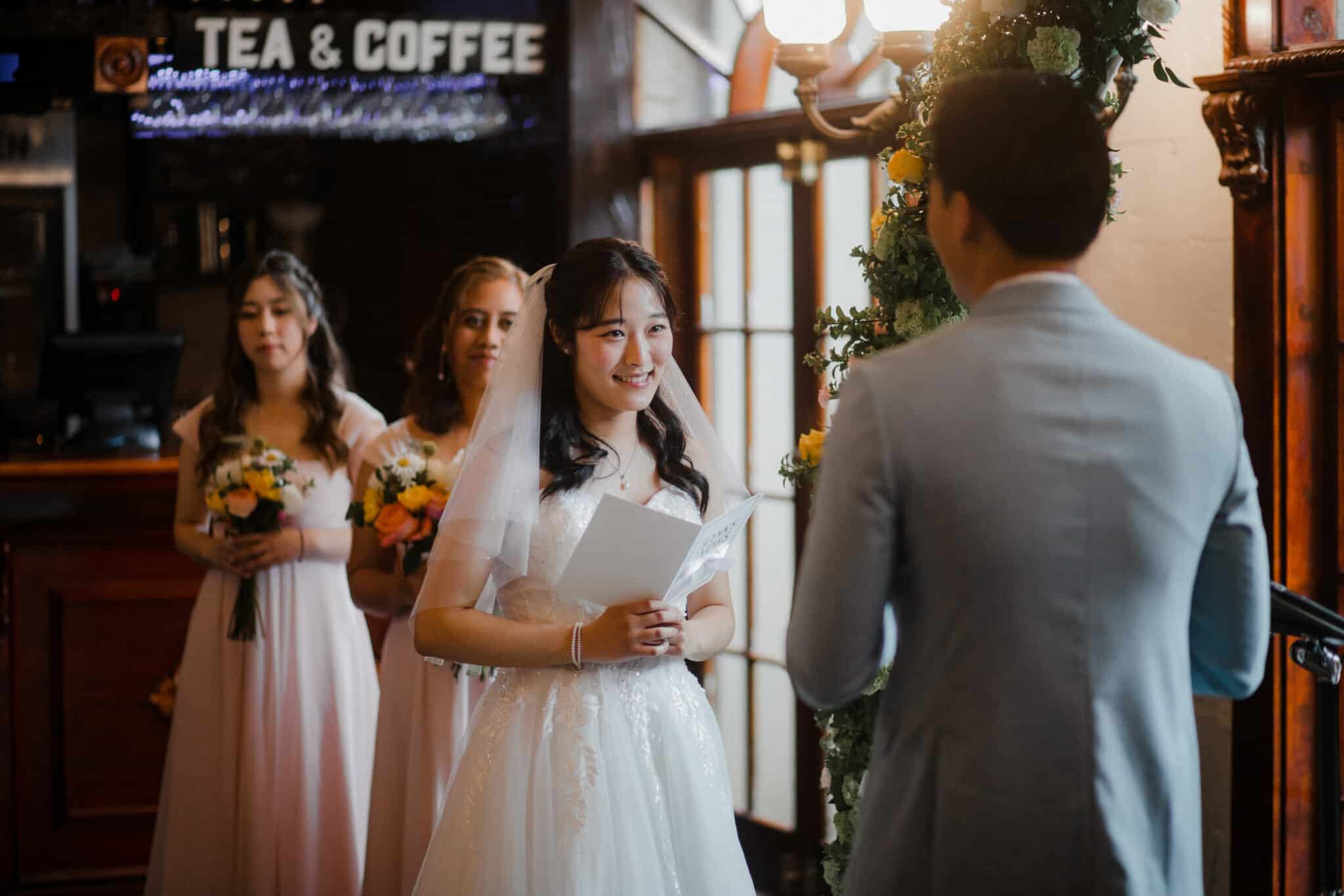 bride reading her wedding vows