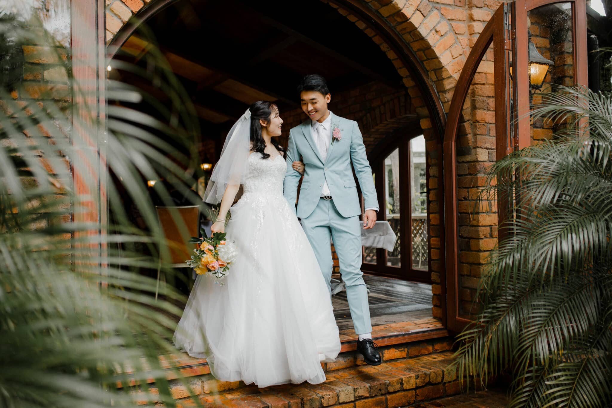 bride and groom strolling