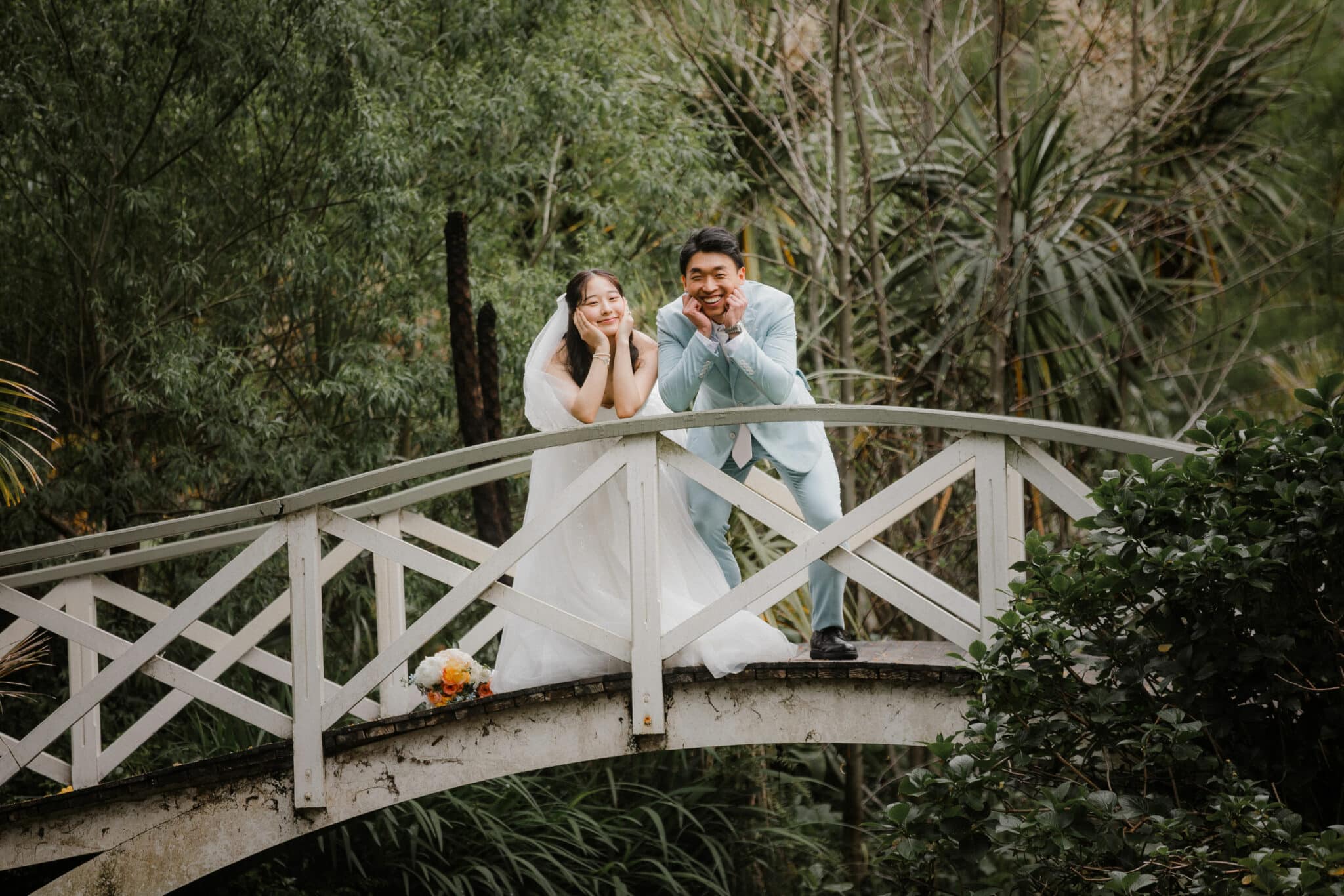 bride and groom playing around