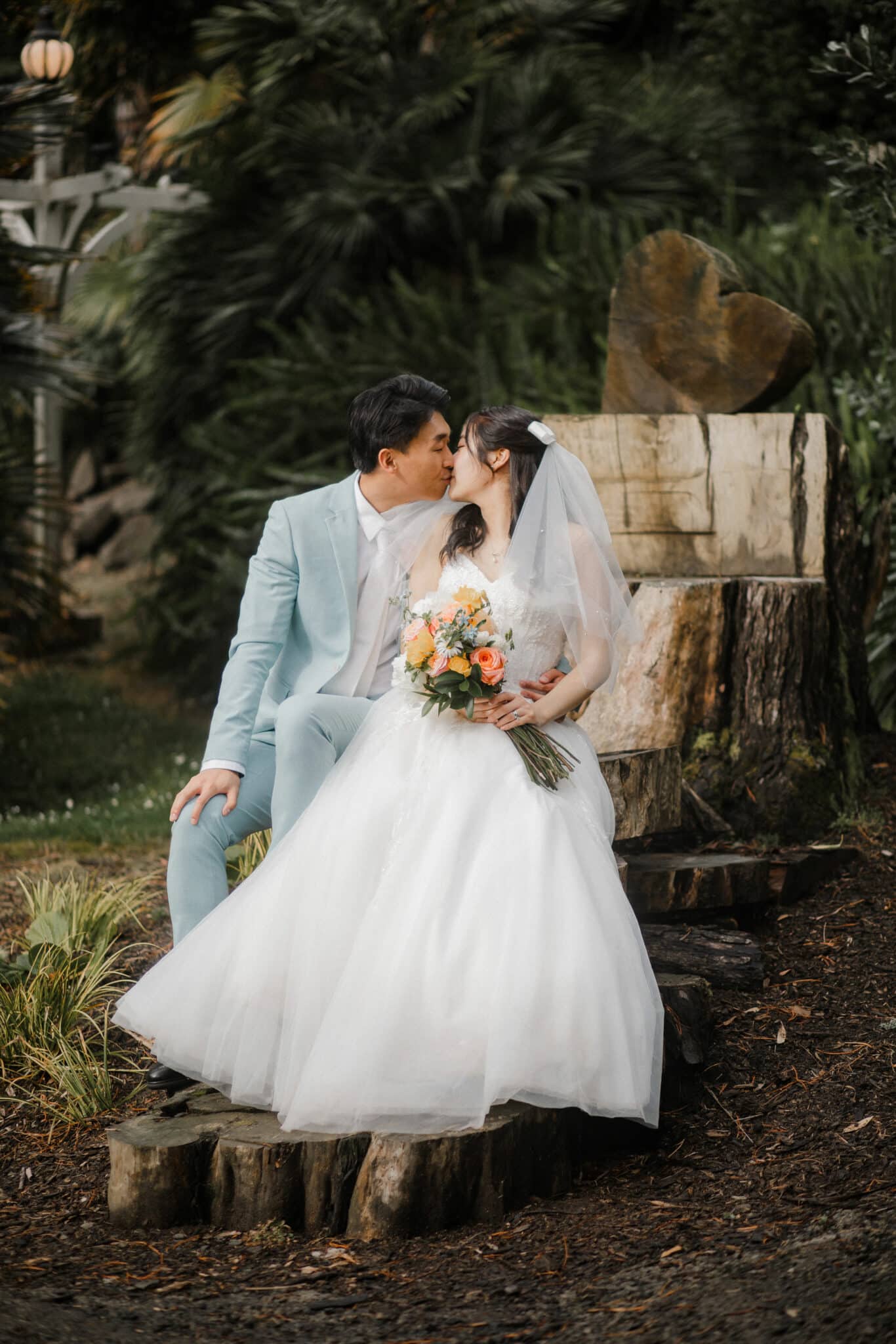 bride and groom kiss