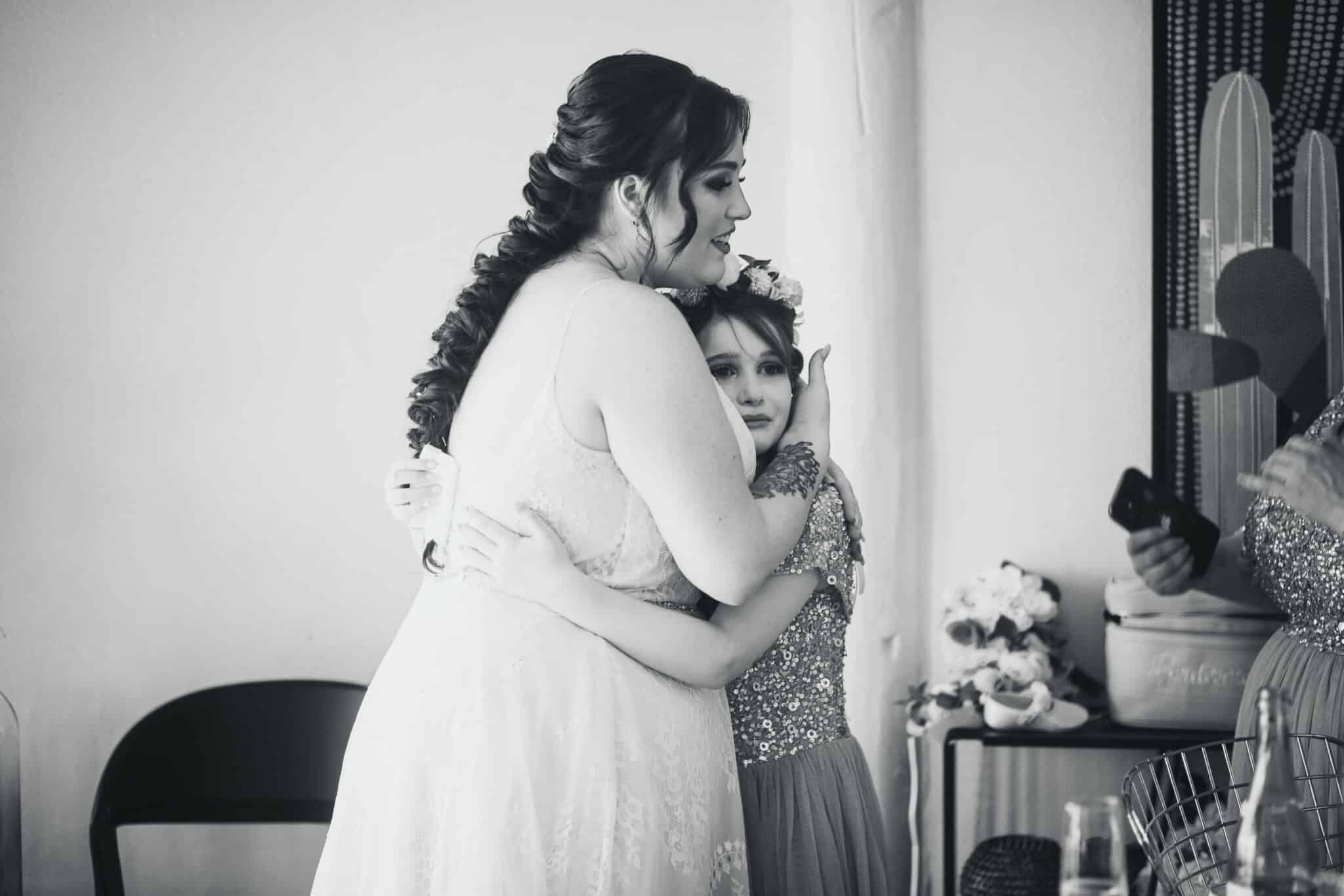 bride and her daughter sharing a moment